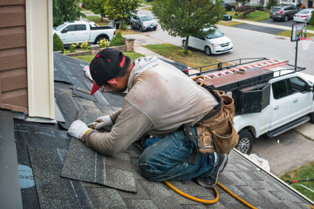 Professional Roof Replacement technician working in Table Grove, IL